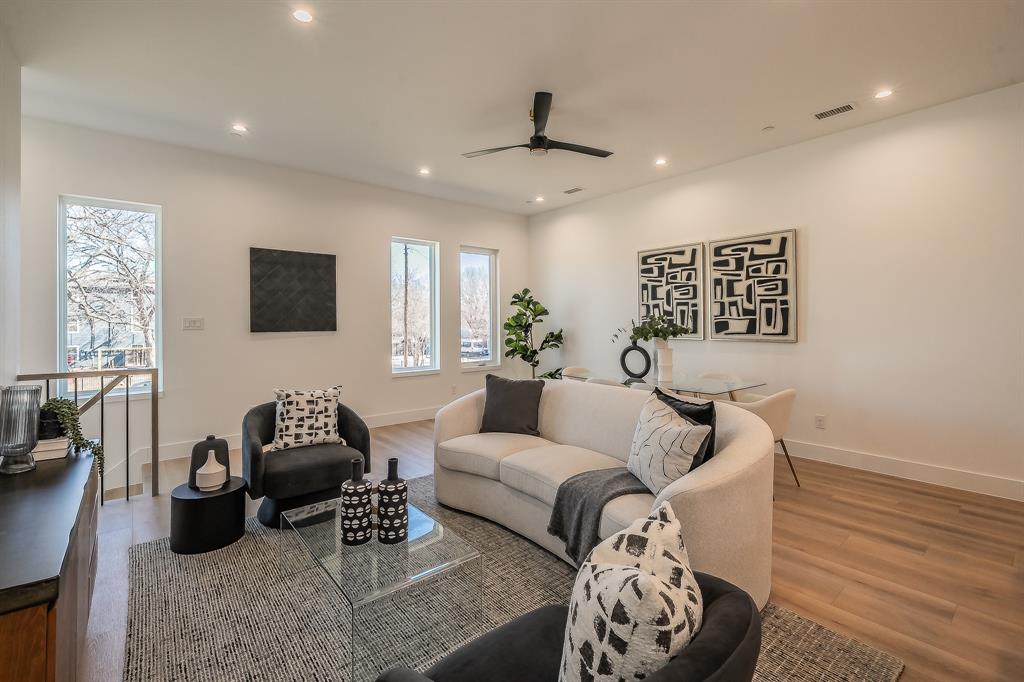 5320 Reiger Avenue, Unit 102 Dallas, TX 75214 - Photo 4 of 33 a living room with furniture and a flat screen tv