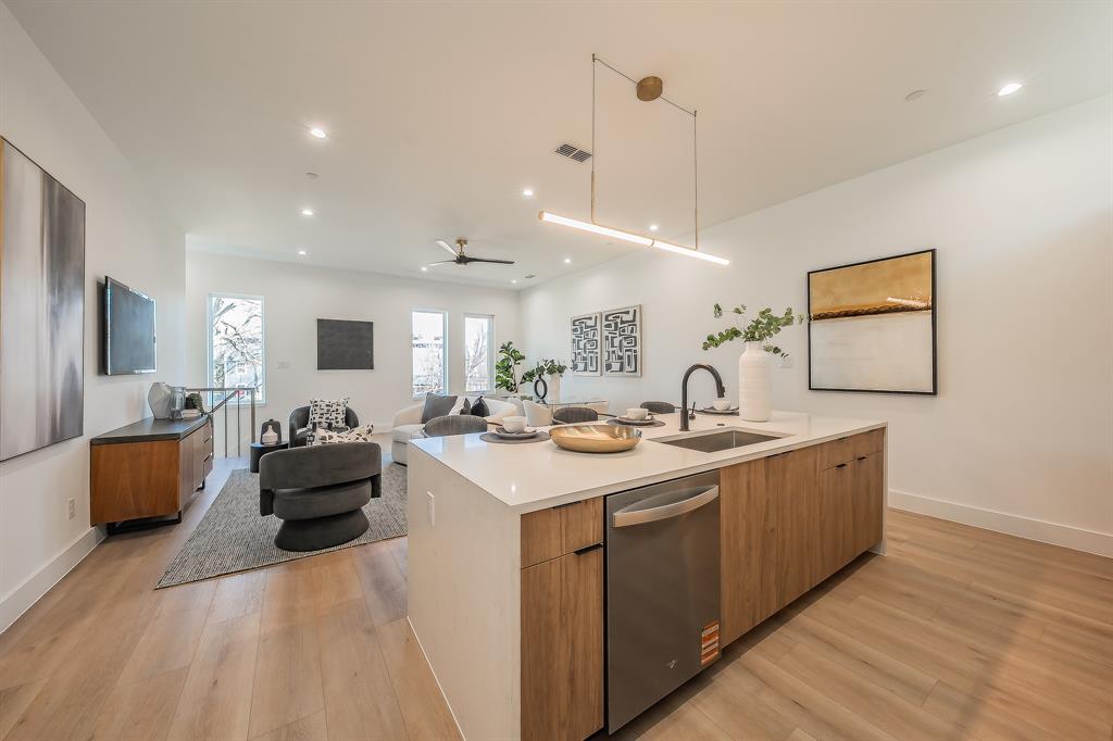 5320 Reiger Avenue, Unit 102 Dallas, TX 75214 - Photo 6 of 33 a large kitchen with sink and cabinets