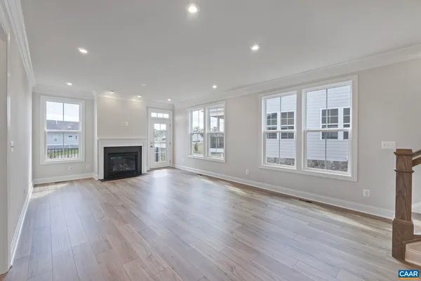 a view of balcony with wooden floor and fence