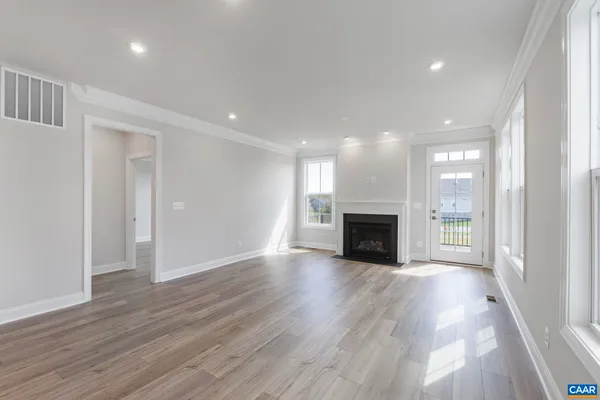 a view of a balcony with wooden floor and fence