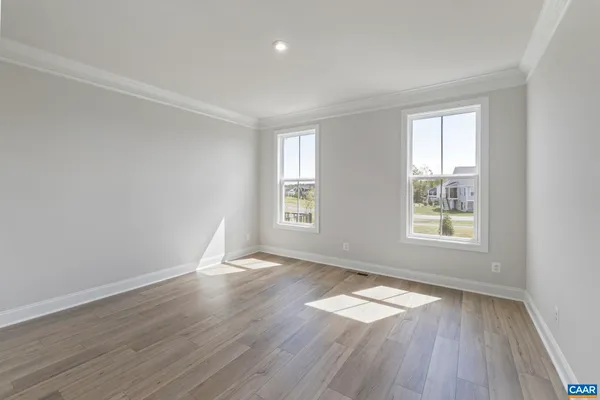 a spacious bathroom with a double vanity sink mirror and shower