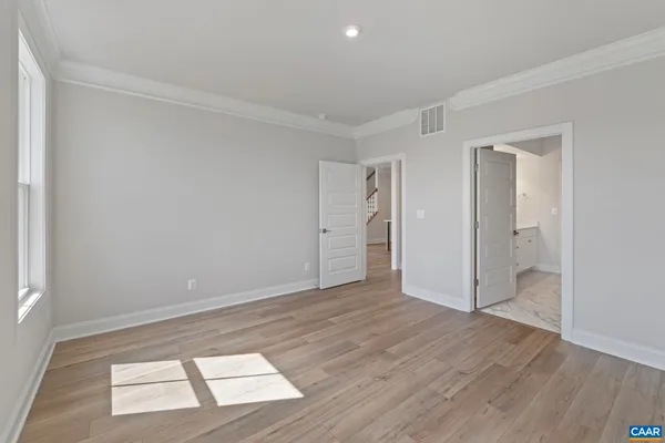 a spacious bathroom with a shower and a sink