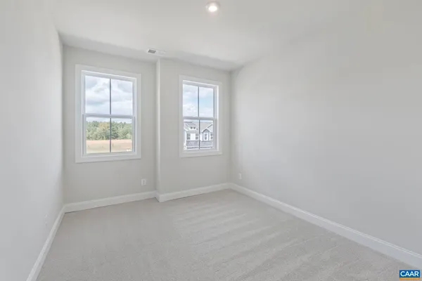a view of a room with shelf on the wall