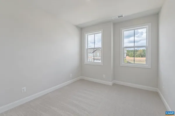 a view of a room with shelf on the wall