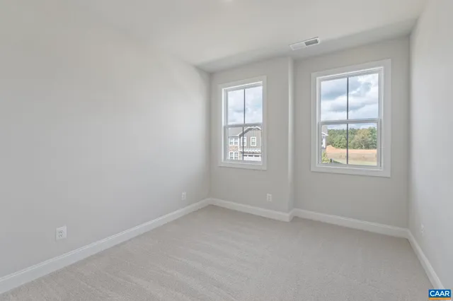a view of a room with shelf on the wall
