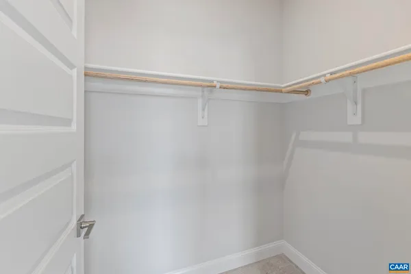 a view of an empty room with stairs