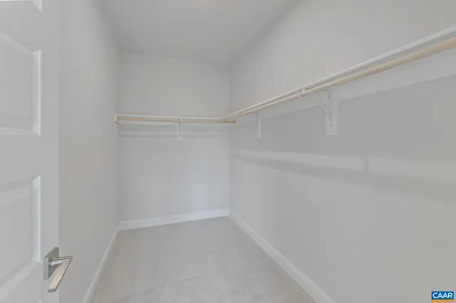 a view of an empty room with wooden walls