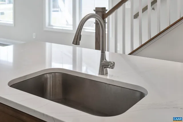 a stove top oven sitting inside of a kitchen