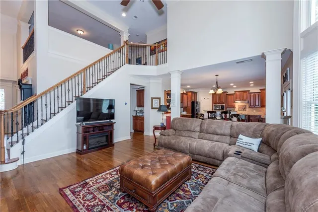 a living room with furniture and a fireplace