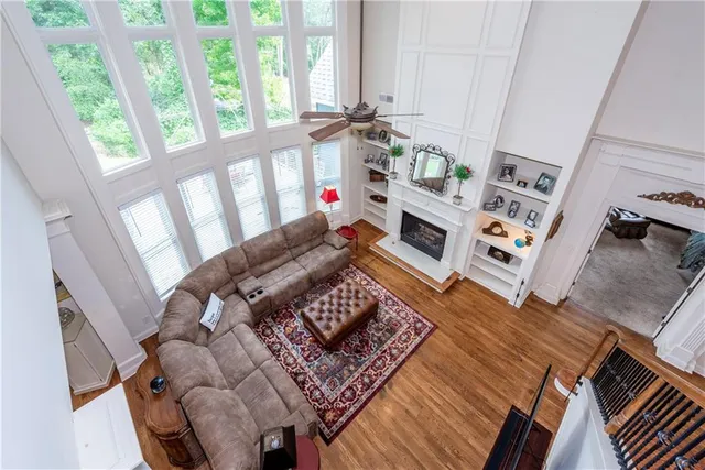 a kitchen with kitchen island granite countertop wooden cabinets and a refrigerator