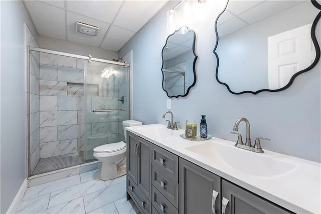 a kitchen with refrigerator cabinets and wooden floor