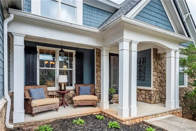 a view of an entryway with wooden floor and windows