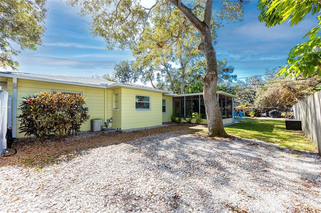 5596 100th Way North St. Petersburg, FL 33708 - Photo 56 of 67 a view of a house with backyard and a tree