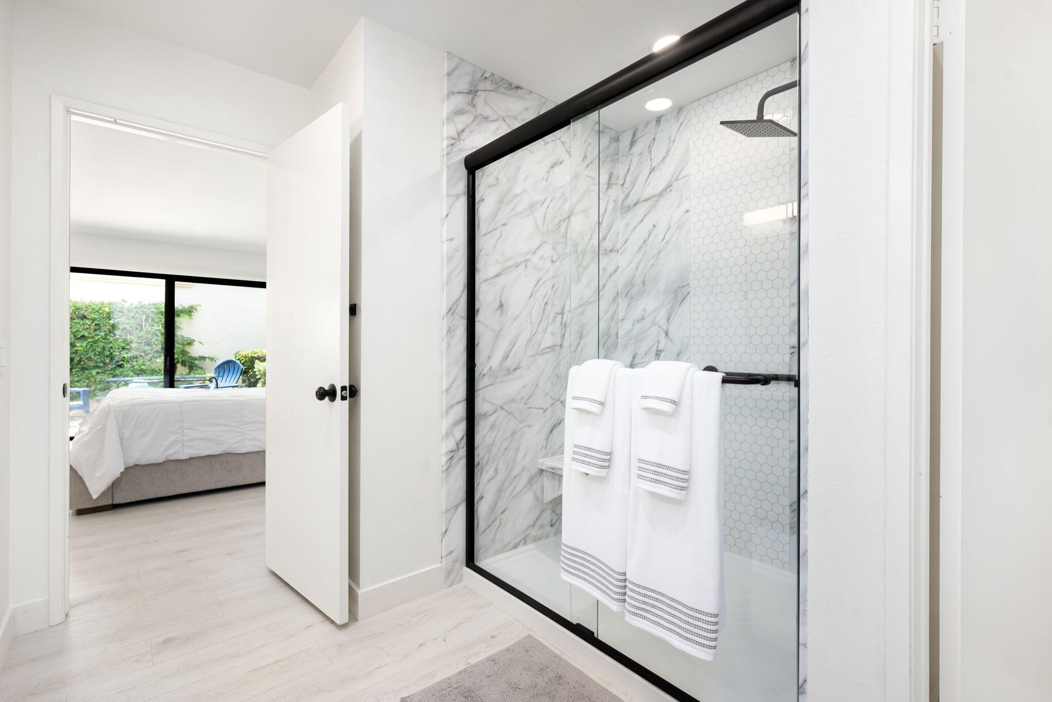 54912 Shoal Creek La Quinta, CA 92253 - Photo 19 of 36 a bathroom with a white tub shower and sink