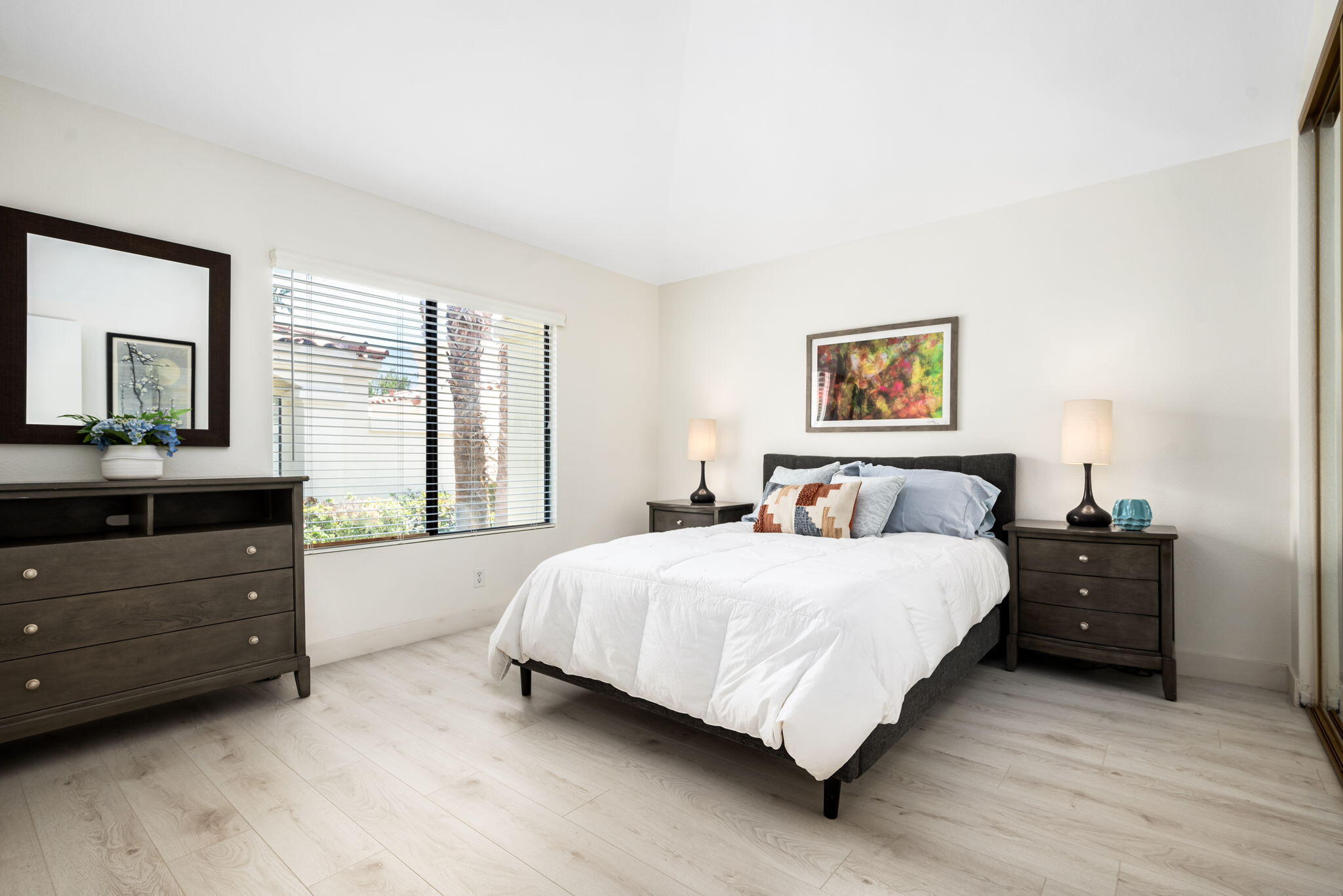 54912 Shoal Creek La Quinta, CA 92253 - Photo 21 of 36 a bedroom with a bed and a dresser