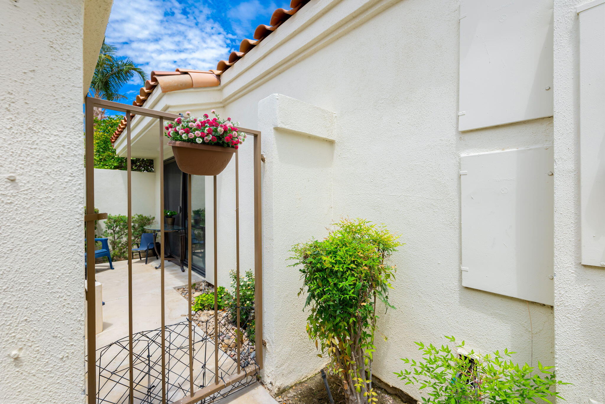 54912 Shoal Creek La Quinta, CA 92253 - Photo 27 of 36 a view of a potted plants from a corridor