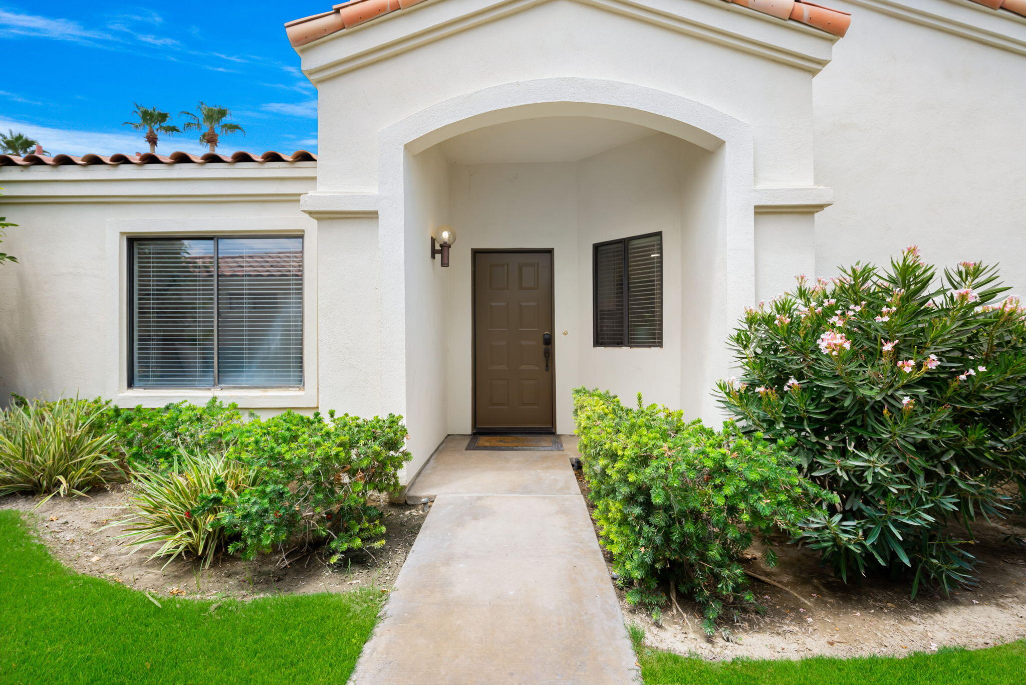 54912 Shoal Creek La Quinta, CA 92253 - Photo 28 of 36 a view of a house with potted plants