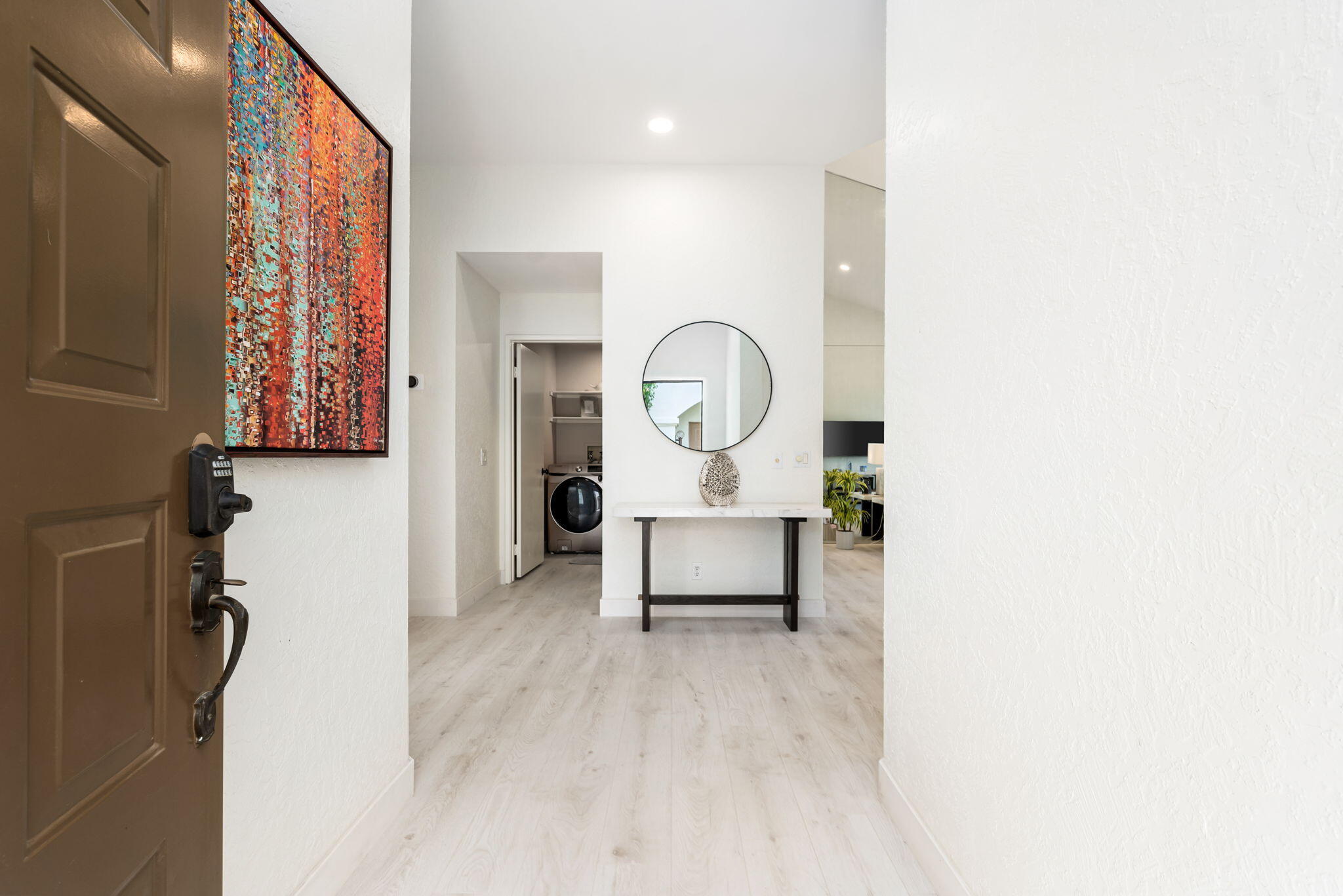 54912 Shoal Creek La Quinta, CA 92253 - Photo 3 of 36 a living room with furniture and a wall painting