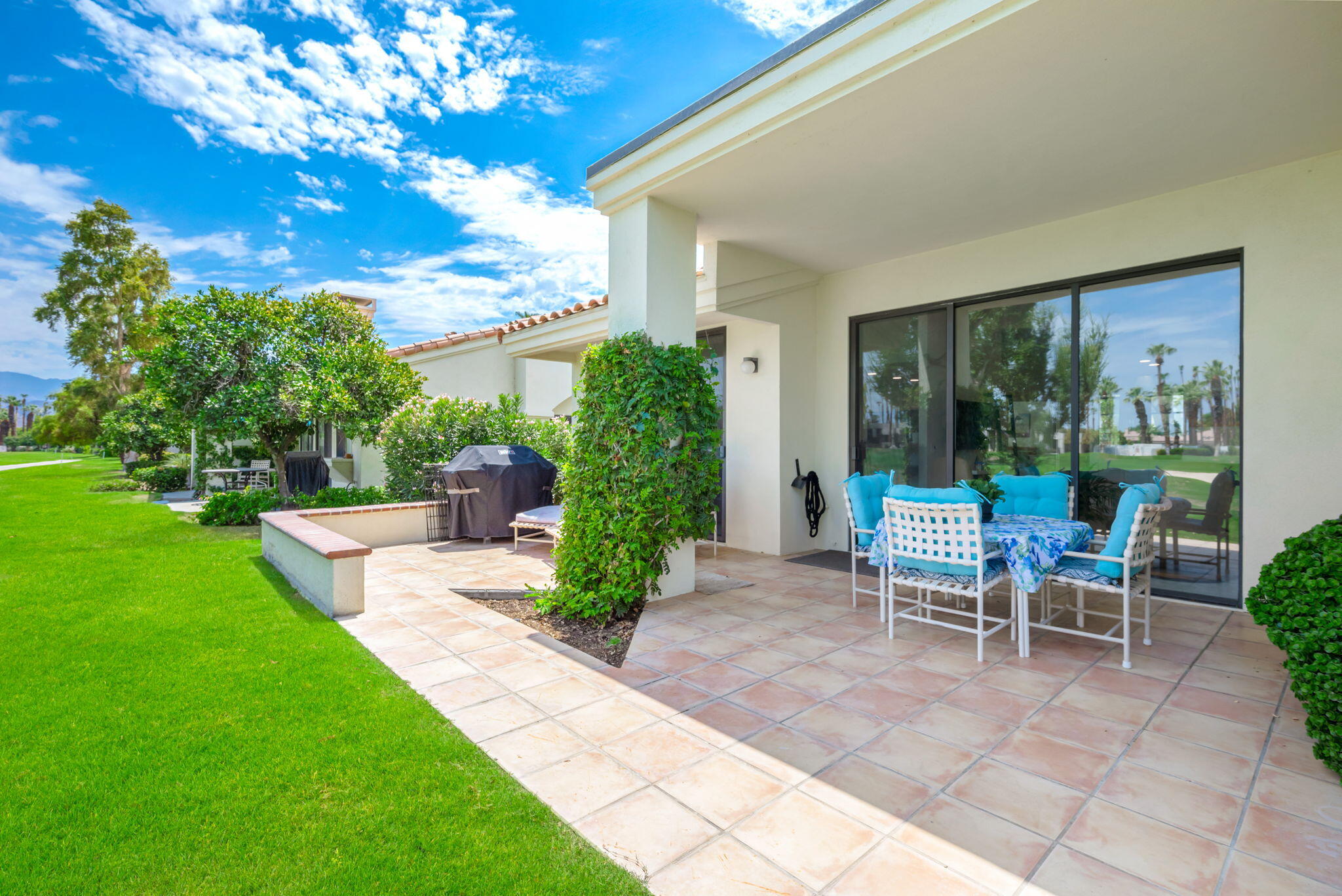 54912 Shoal Creek La Quinta, CA 92253 - Photo 31 of 36 a view of a chair and table in backyard of the house