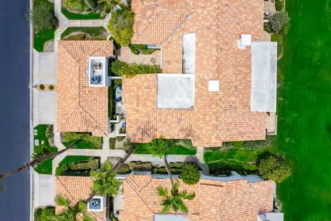 an aerial view of a house with a garden