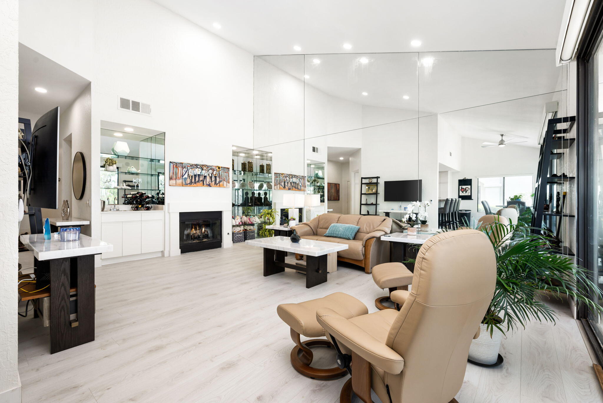 54912 Shoal Creek La Quinta, CA 92253 - Photo 6 of 36 a living room with furniture kitchen view and a fireplace