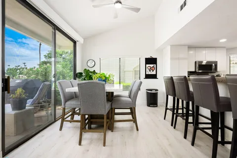 a view of a dining room with furniture window and outside view