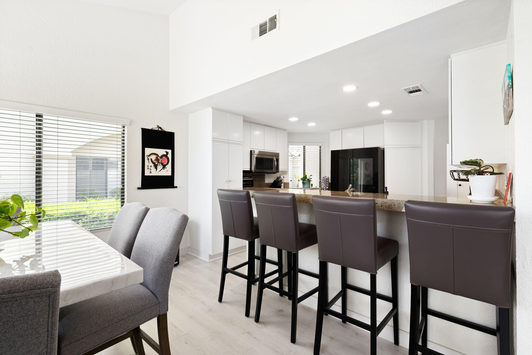 54912 Shoal Creek La Quinta, CA 92253 - Photo 10 of 36 a view of a dining room with furniture and a kitchen