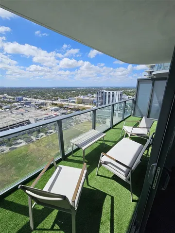 a view of an chairs and tables in the patio