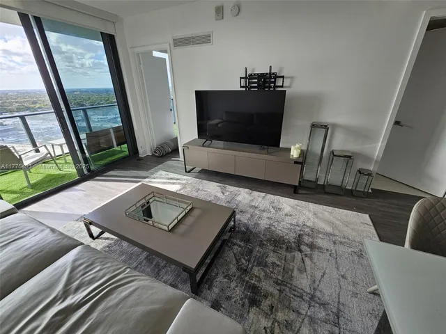 a living room with furniture rug and a rug