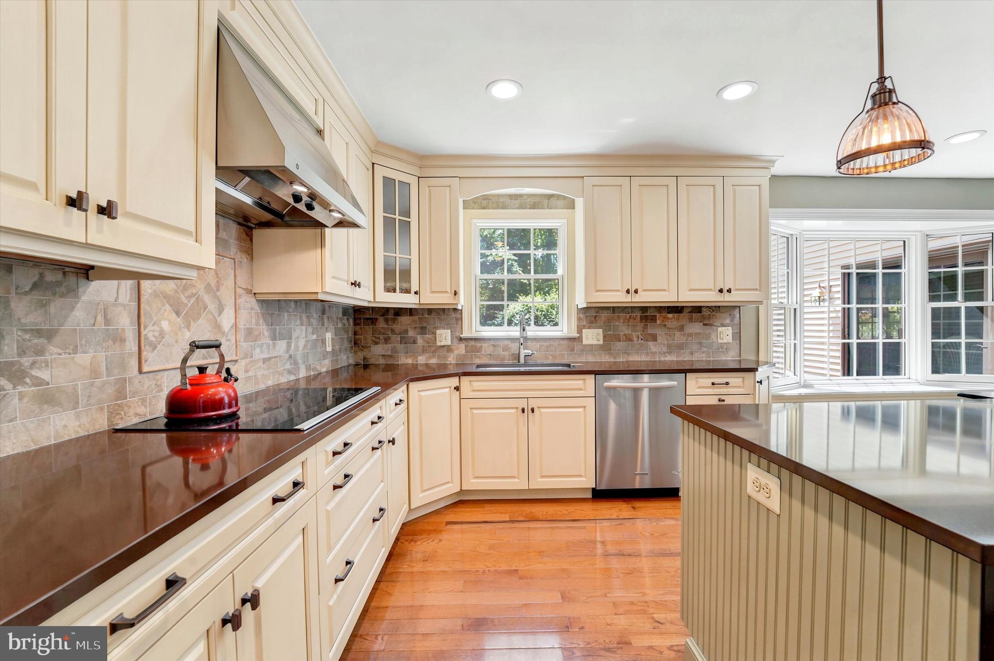 1980 Terwood Road Huntingdon Valley, PA 19006 - Photo 6 of 48 a kitchen with stainless steel appliances granite countertop a sink and a stove