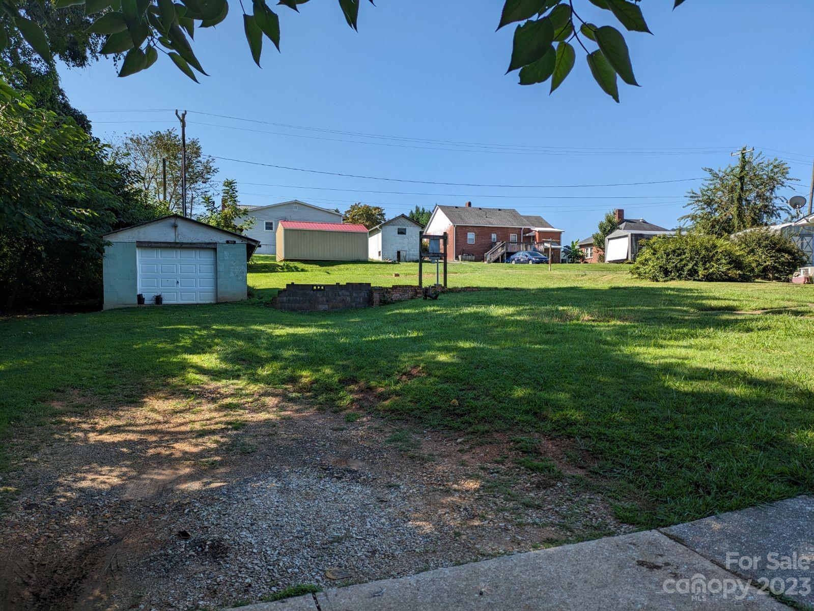 100 West 4th Street Marion, NC 28752 - Photo 5 of 10 a view of a house with a big yard