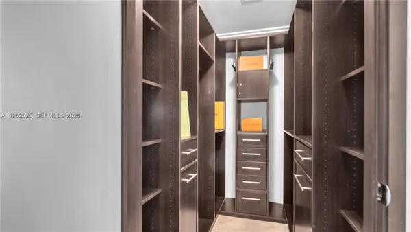 a bathroom with a glass door shower and sink