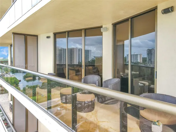 a view of a glass door with a balcony