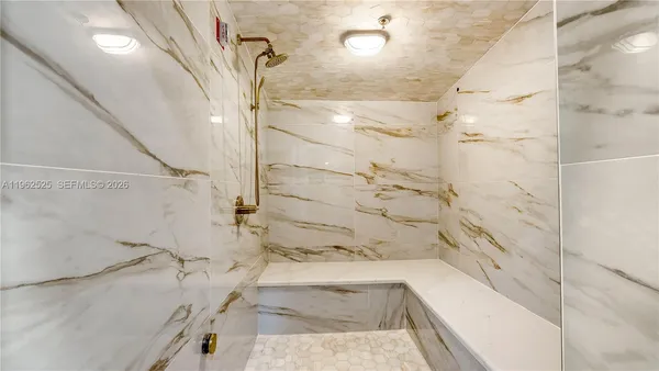 a bathroom with a bathtub and shower