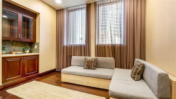 a view of walk in closet with empty room