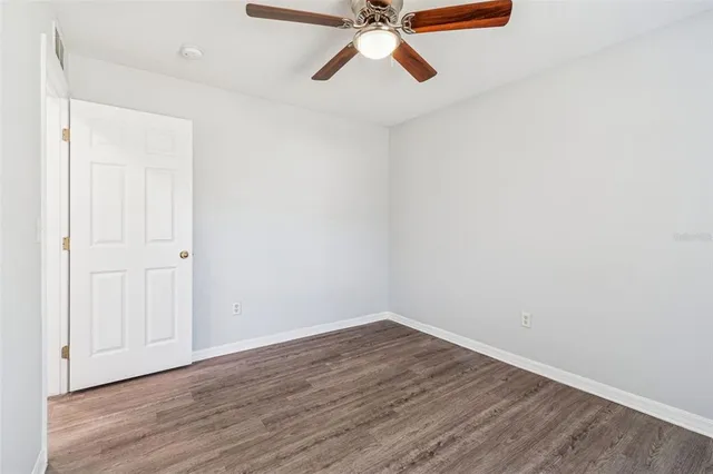 an aerial view of a house with a swimming pool and mountains