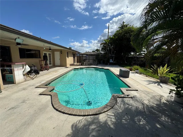 a view of a swimming pool with a patio