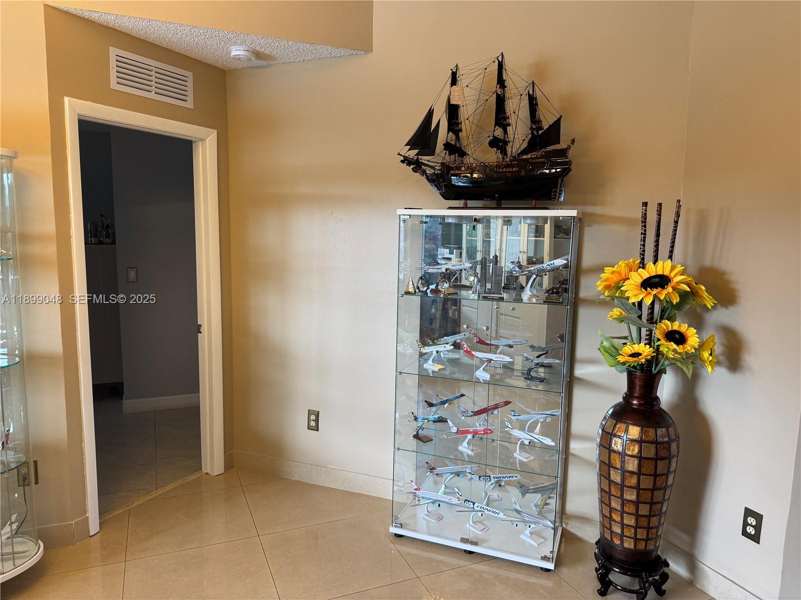 14700 Southwest 151st Terrace Miami, FL 33196 - Photo 5 of 19 a glass vase with flowers on the table