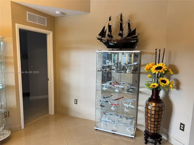 a table with wine bottles and glasses on it