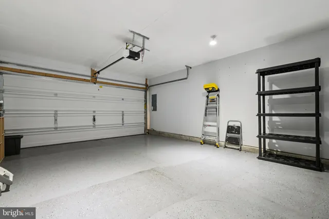 a view of an empty room with a cabinet