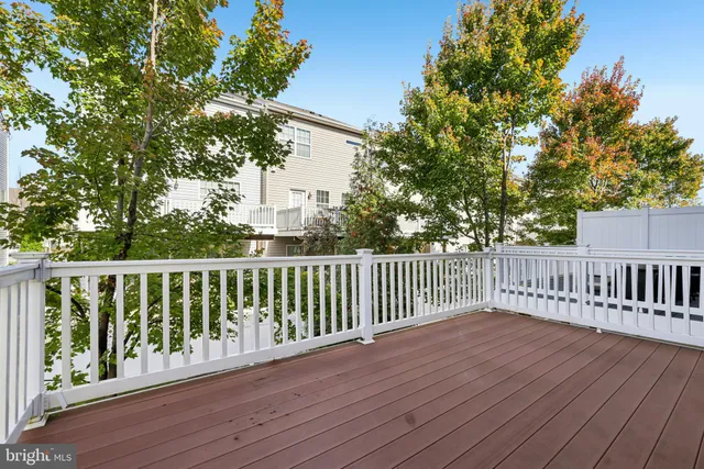 a view of a house with wooden deck