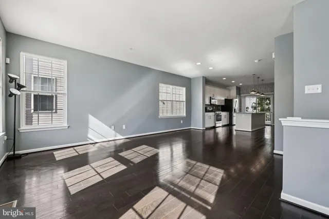 a view of kitchen and dining room with wooden floor