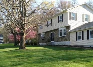 5 High Meadow Road Shelton, CT 06484 - Photo 1 of 1 a front view of house with yard and green space