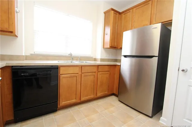 a white refrigerator freezer sitting in a kitchen