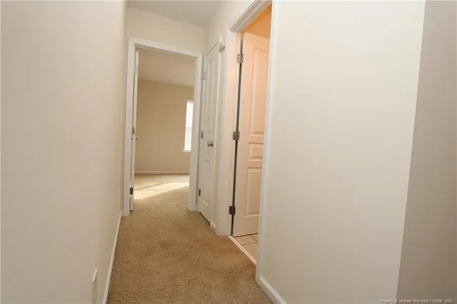 a view of a hallway with a white walls