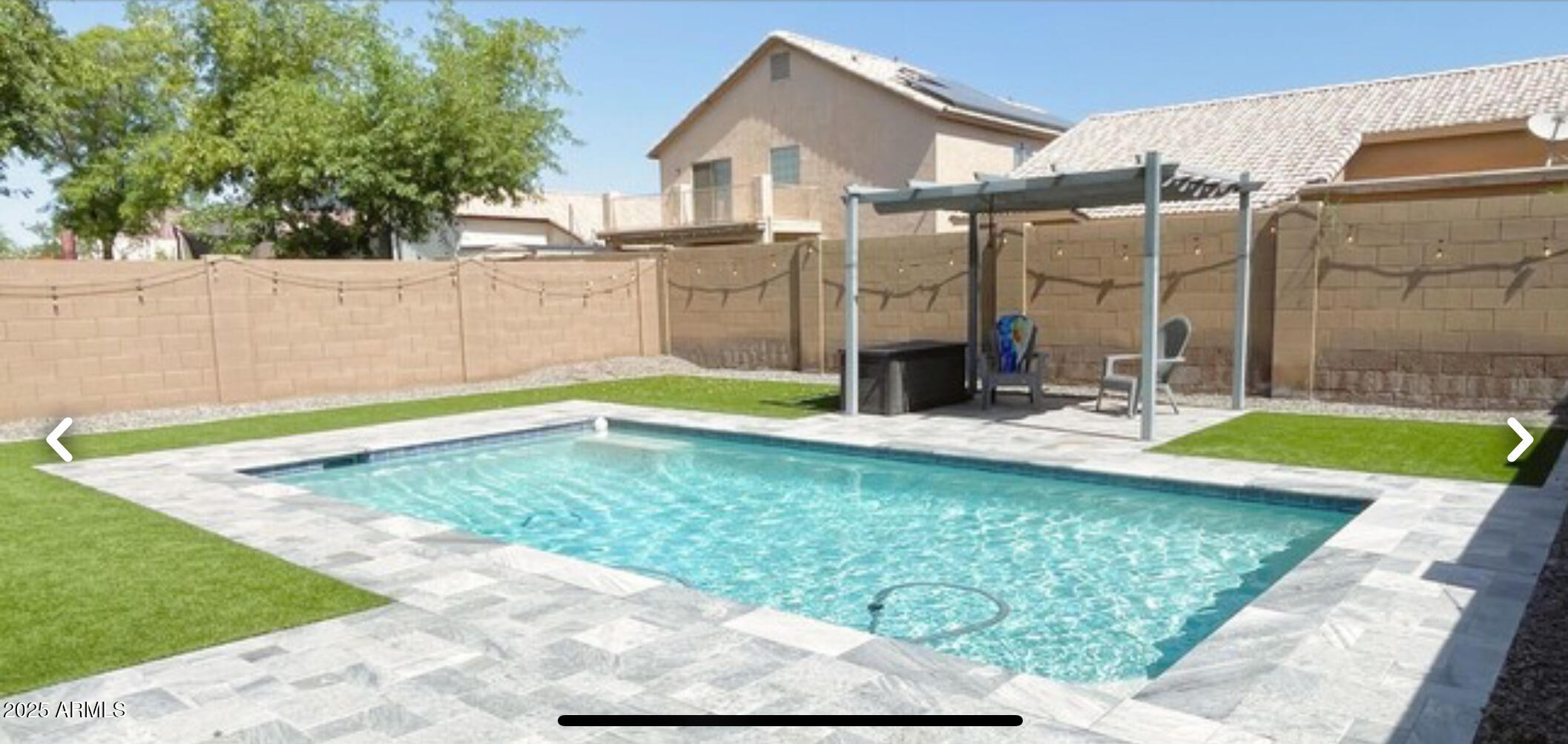 2542 West Gaby Road Phoenix, AZ 85041 - Photo 11 of 12 a view of a backyard with swimming pool