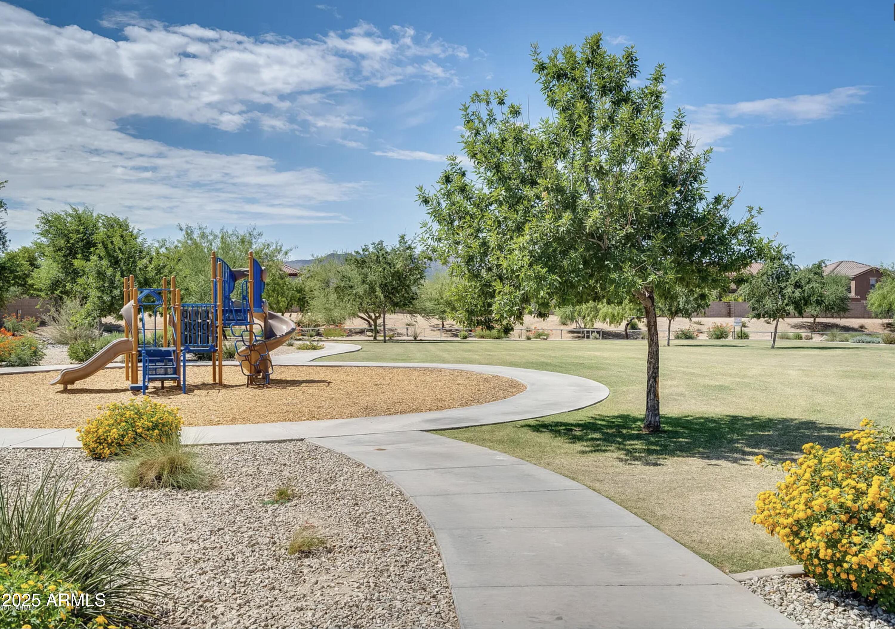 2542 West Gaby Road Phoenix, AZ 85041 - Photo 12 of 12 a view of a yard with yellow house
