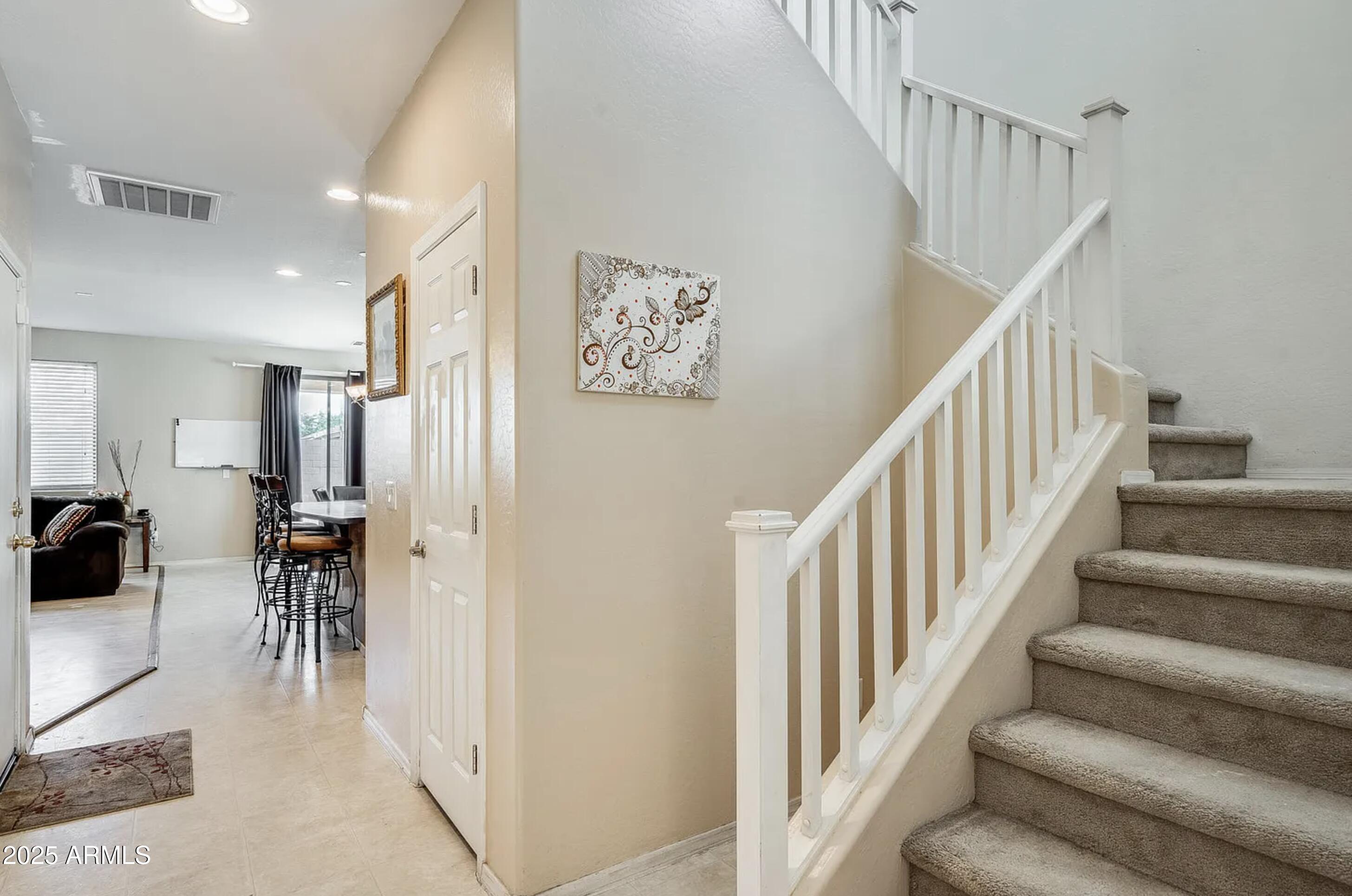 2542 West Gaby Road Phoenix, AZ 85041 - Photo 5 of 12 a view of entryway and hall with dining room