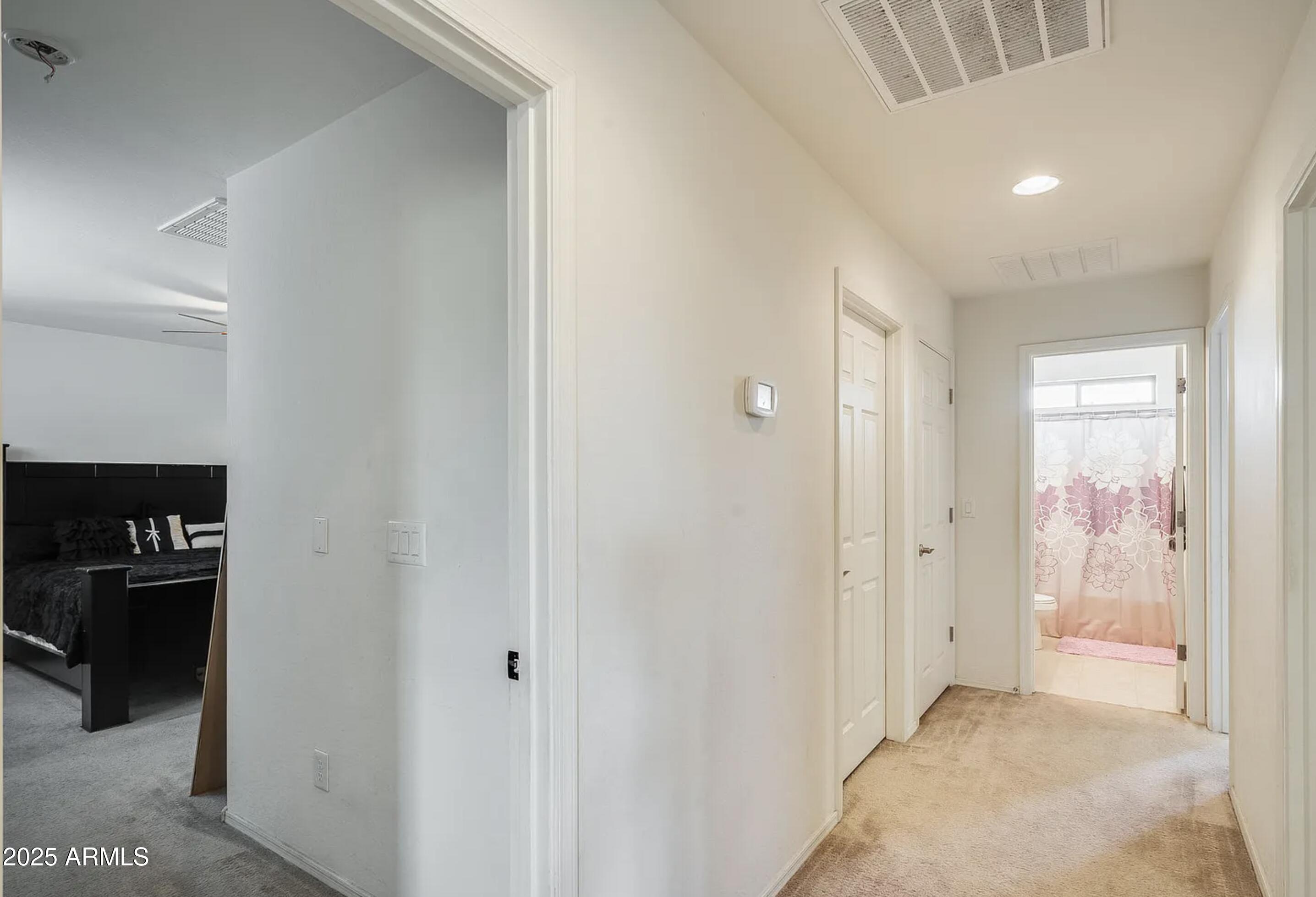 2542 West Gaby Road Phoenix, AZ 85041 - Photo 9 of 12 a view of a hallway to rooms
