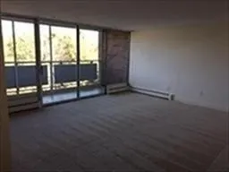 a view of an empty room with glass door
